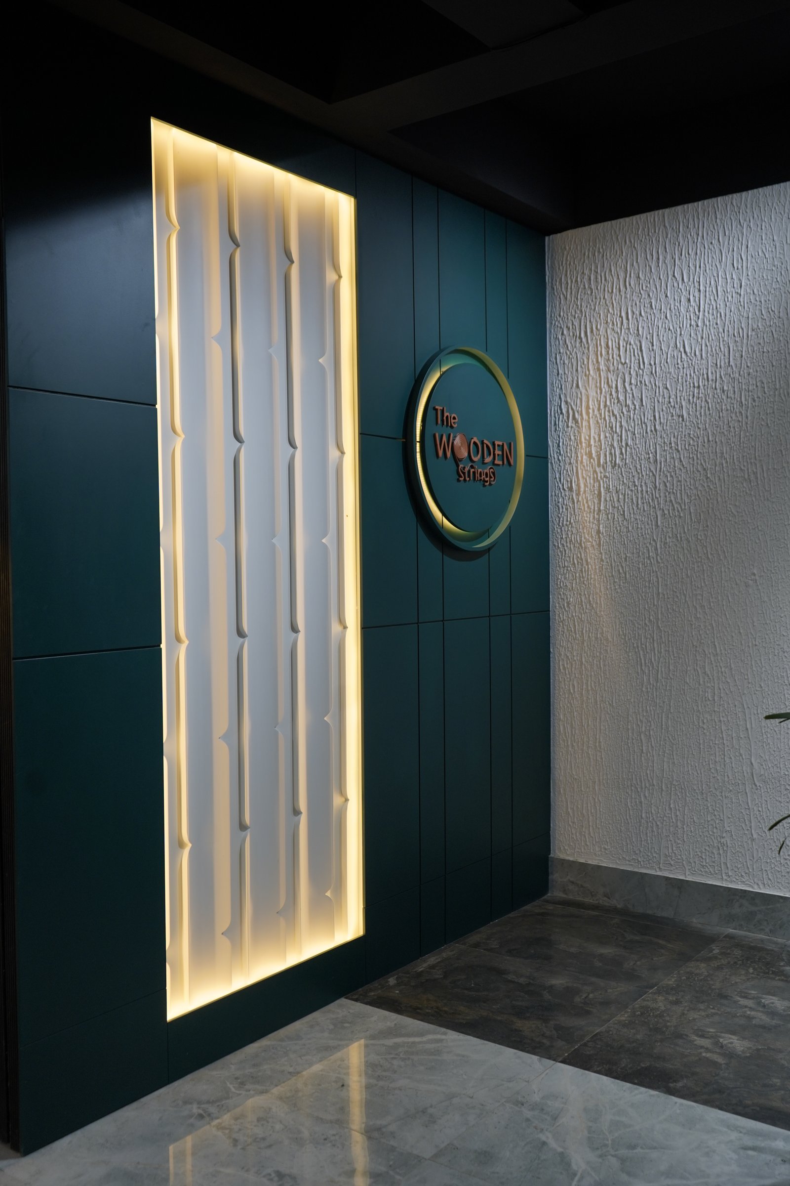 The Wooden Strings custom interior finish and branded wall detail